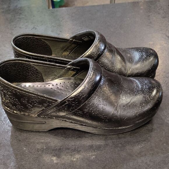 Dansko Black Floral Embossed Clogs - Picture 1 of 6